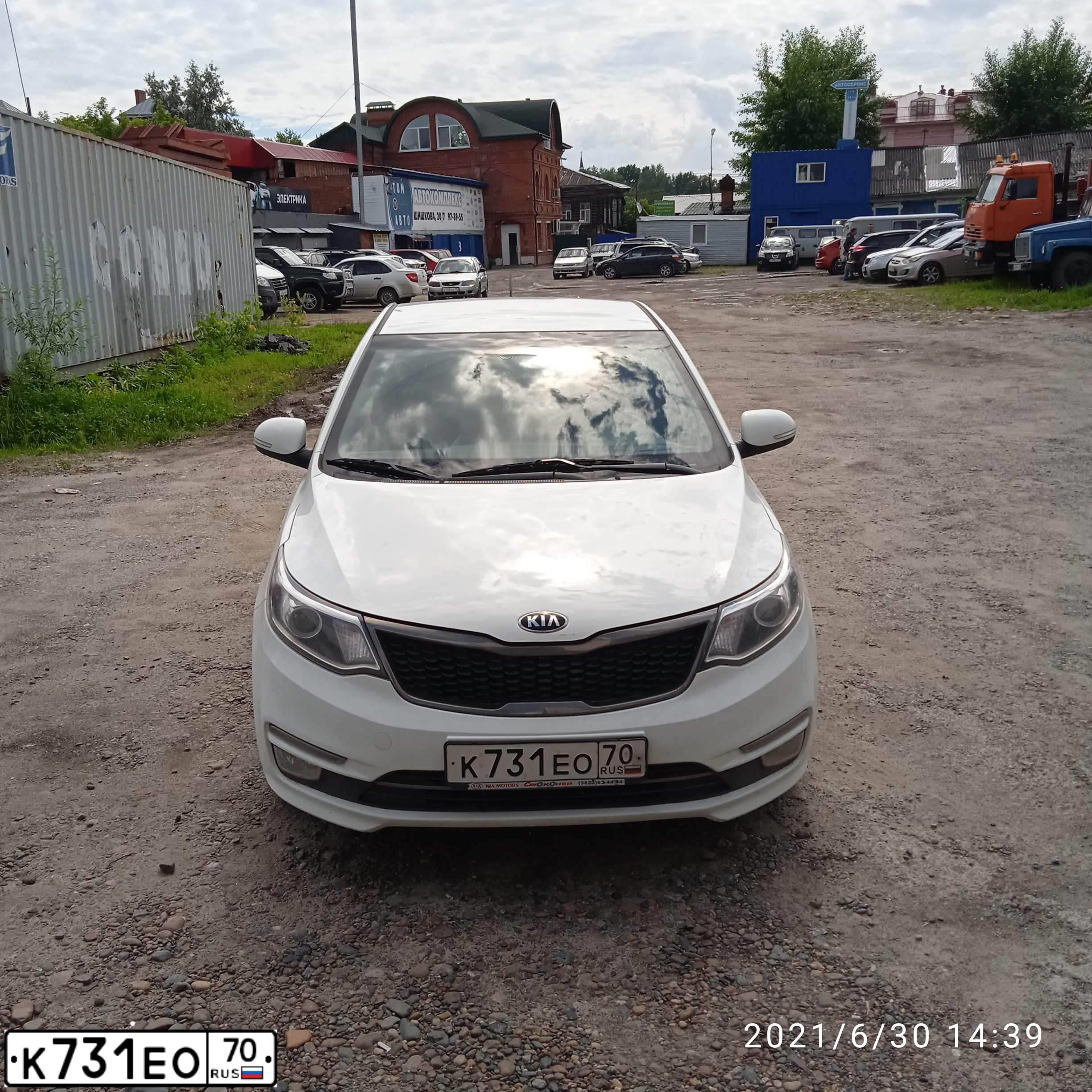 Фото автомобиля KIA RIO, 2016 — госномер К731ЕО70. Цвет: БЕЛЫЙ