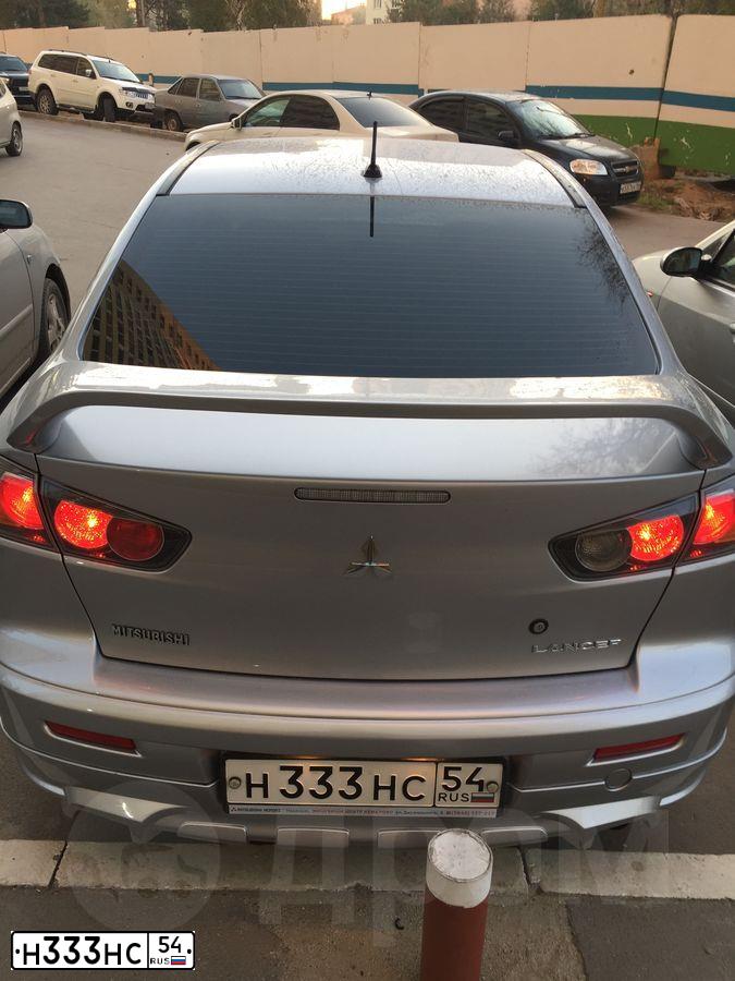 Фото автомобиля MITSUBISHI LANCER, 2013 — госномер Н333НС54. Цвет: Серебристый