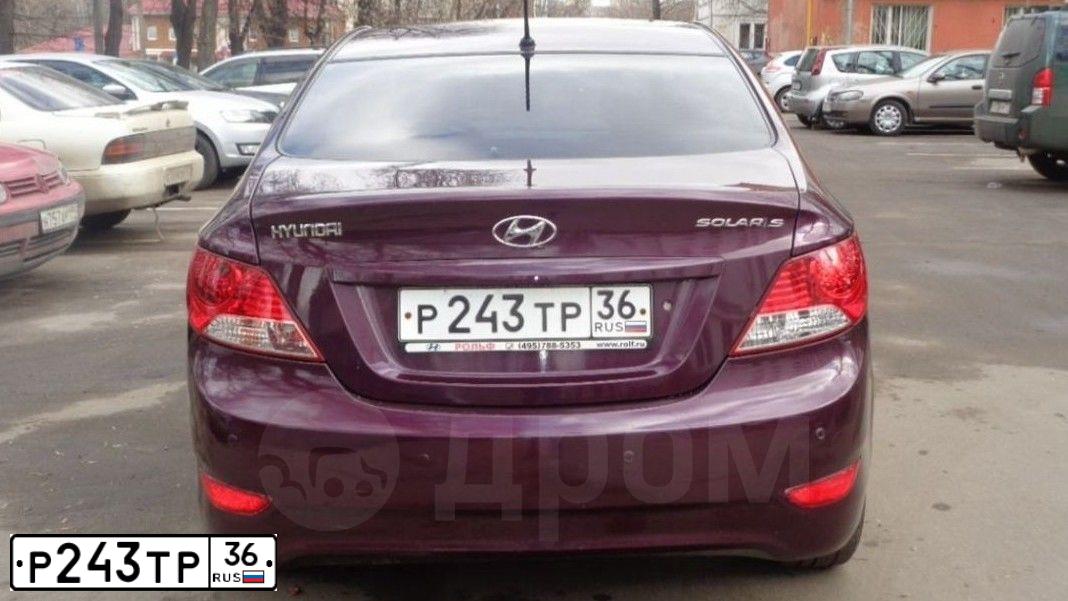 Фото автомобиля HYUNDAI SOLARIS, 2011 — госномер Р243ТР36. Цвет: ФИОЛЕТОВЫЙ