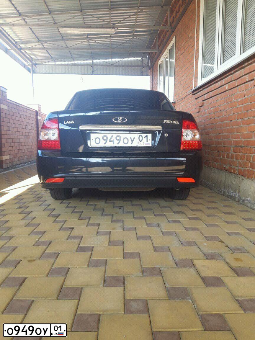 Фото автомобиля LADA PRIORA, 2015 — госномер Р203ХТ05. Цвет: ЧЕРНЫЙ