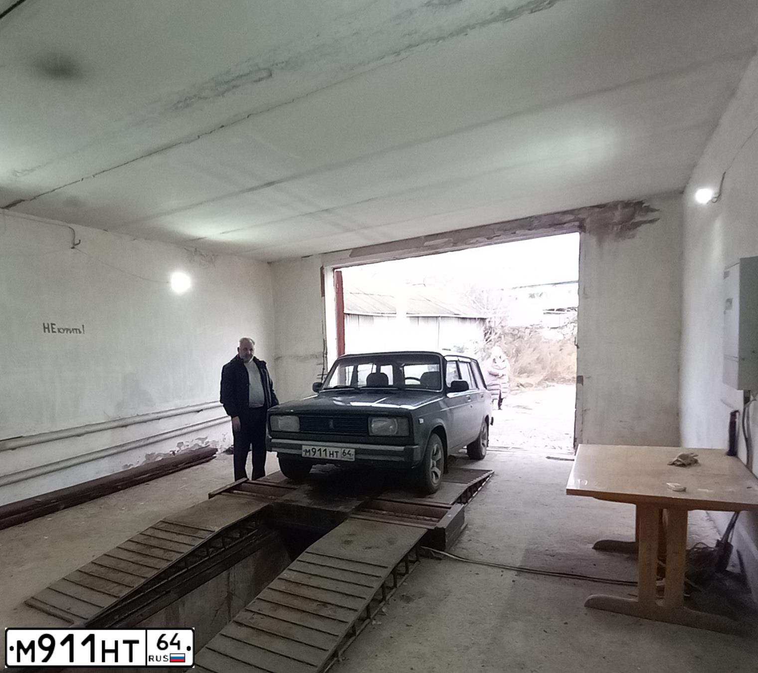 Фото автомобиля LADA 2104, 1999 — госномер М911НТ64. Цвет: ЗЕЛЕНЫЙ
