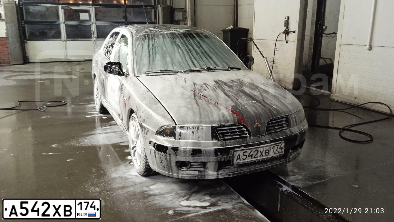 Фото автомобиля MITSUBISHI CARISMA, 2002 — госномер В083НВ45. Цвет: Серый