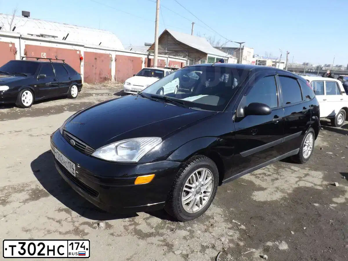 Фото автомобиля FORD FOCUS, 2003 — госномер Т302НС174. Цвет: ЧЕРНЫЙ