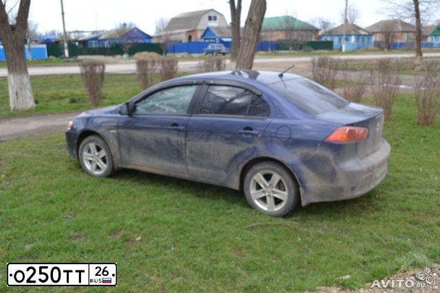 Фото автомобиля MITSUBISHI LANCER, 2008 — госномер Н028СТ126. Цвет: синий