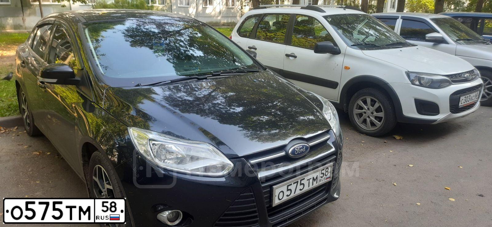 Фото автомобиля FORD FOCUS, 2013 — госномер О575ТМ58. Цвет: ЧЕРНЫЙ