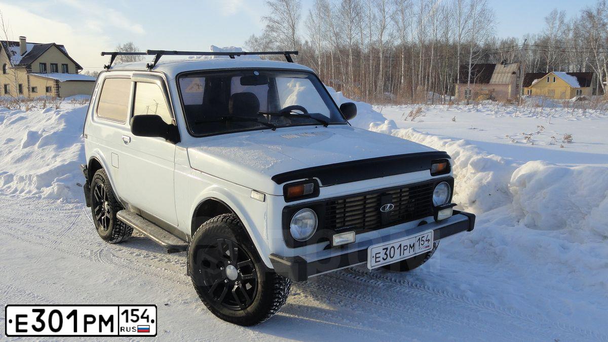 Фото автомобиля LADA 2121 NIVA, 2001 — госномер Е301РМ154. Цвет: ЯРКО БЕЛЫЙ