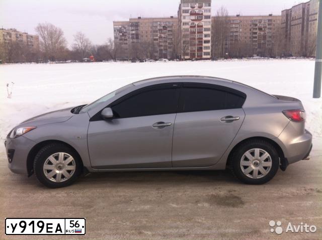 Фото автомобиля MAZDA A 3, 2010 — госномер У919ЕА56. Цвет: серебристый