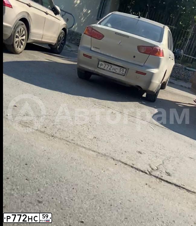 Фото автомобиля MITSUBISHI LANCER, 2011 — госномер Х848НТ761