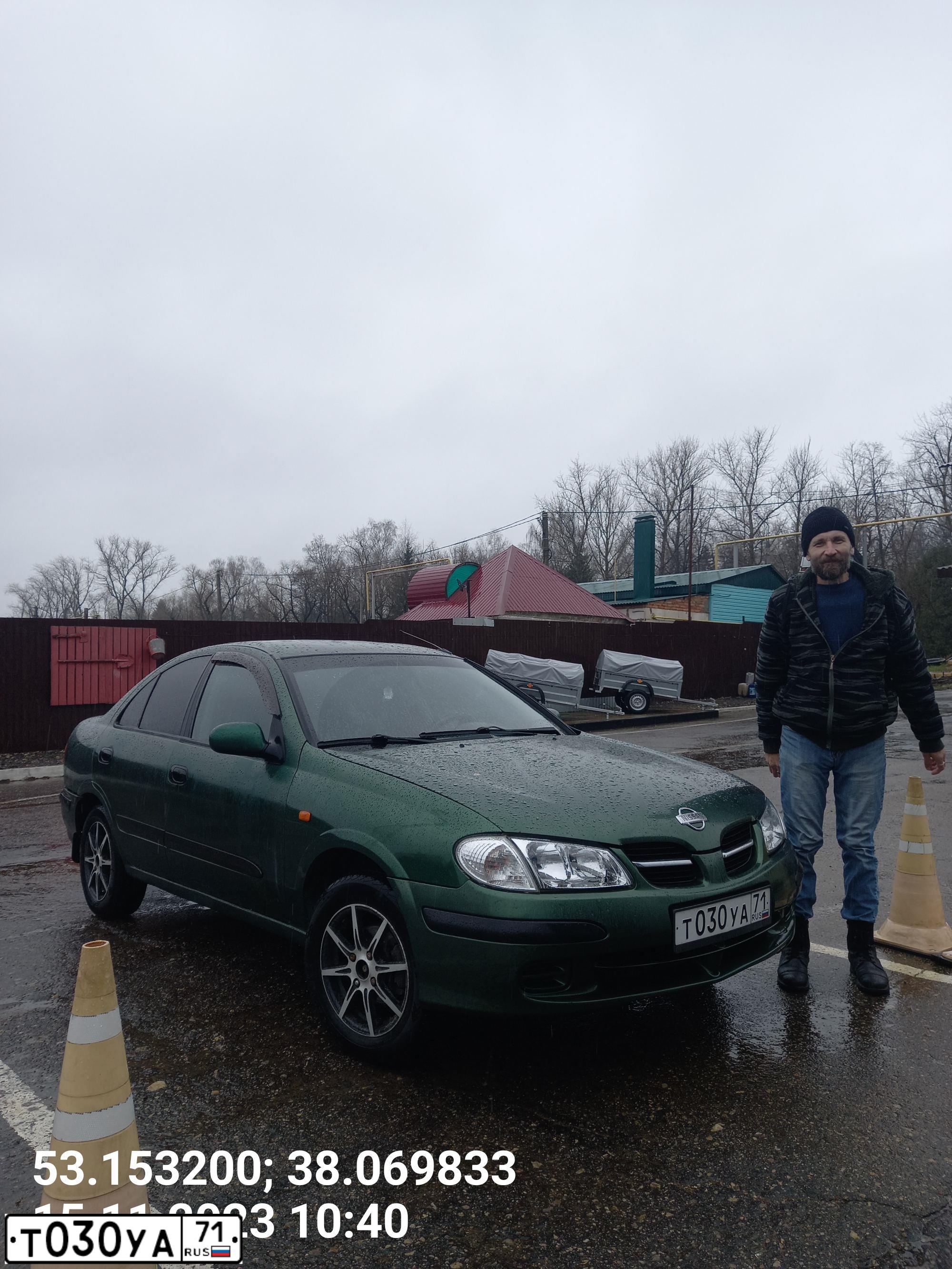Фото автомобиля NISSAN ALMERA, 2001 — госномер Т321СЕ99. Цвет: ЗЕЛЕНЫЙ