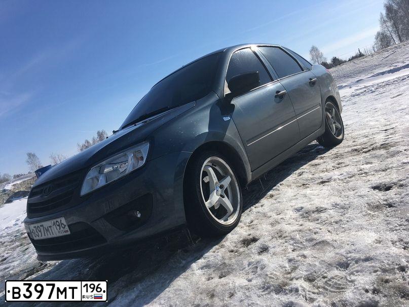 Фото автомобиля LADA 2190 GRANTA, 2014 — госномер Т121ТК72. Цвет: СЕРО-СИНИЙ