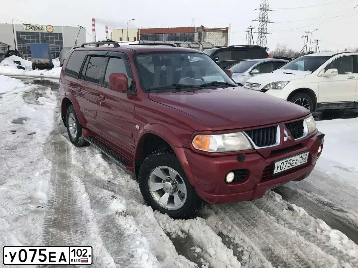 Фото автомобиля MITSUBISHI PAJERO SPORT, 2008 — госномер Н222СМ72. Цвет: Красный