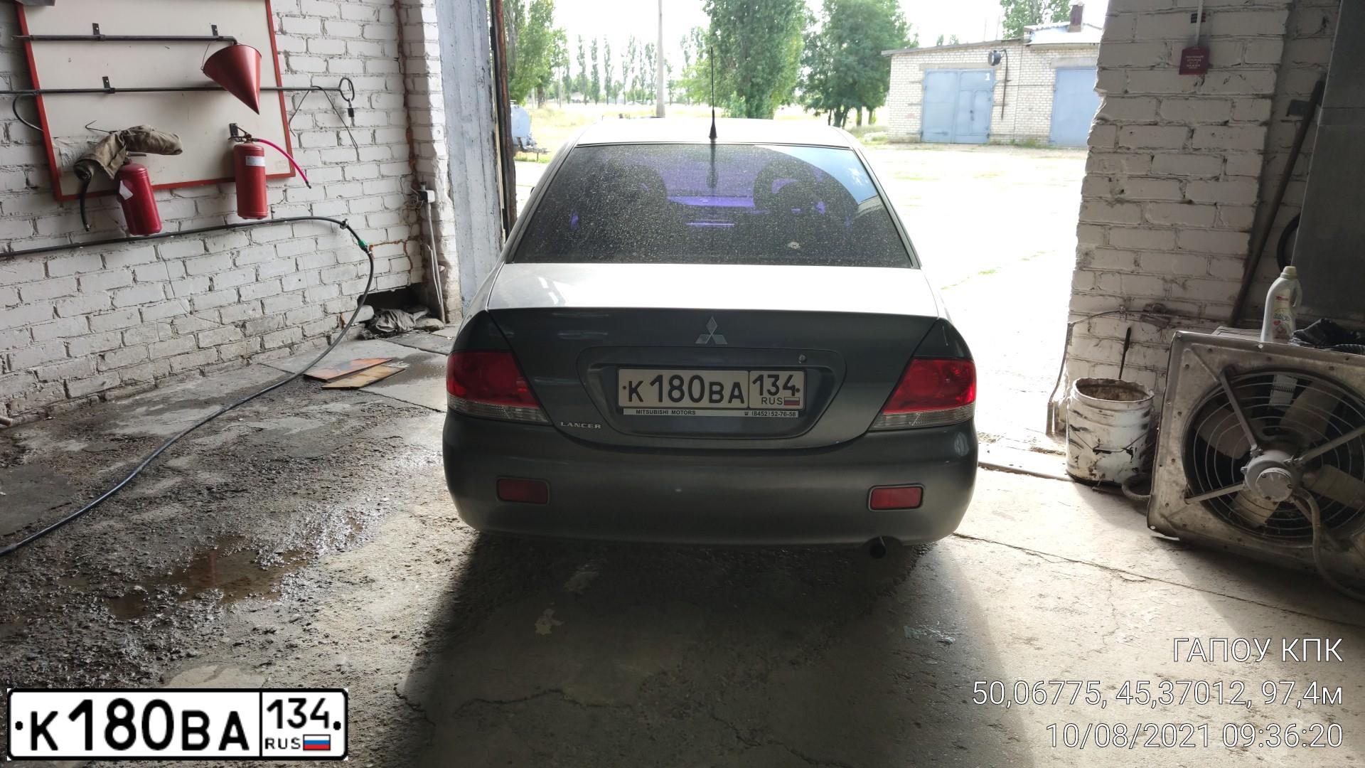 Фото автомобиля MITSUBISHI LANCER, 2006 — госномер К180ВА134. Цвет: СЕРЫЙ