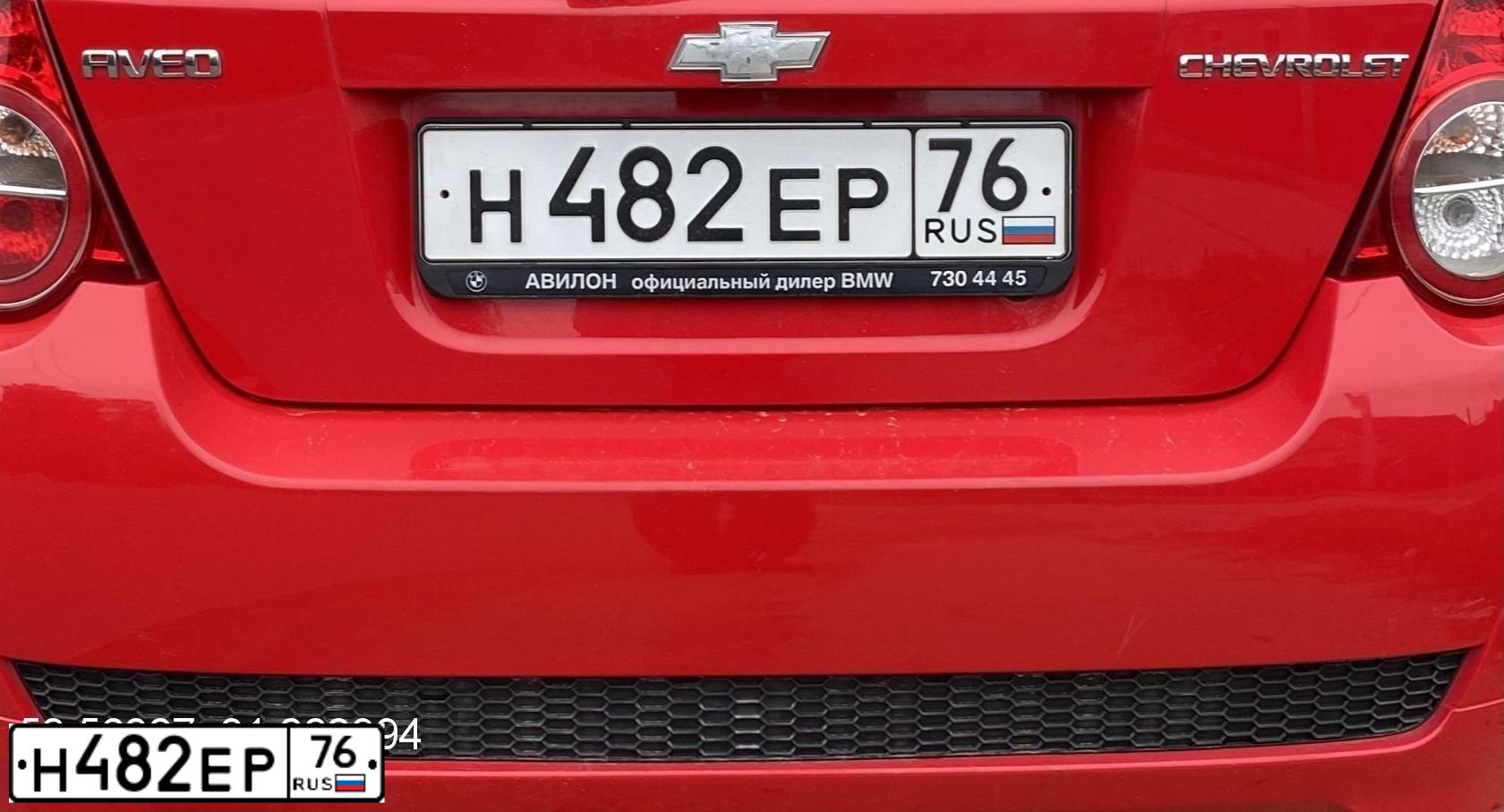 Фото автомобиля CHEVROLET AVEO, 2010 — госномер Н482ЕР76. Цвет: Красный