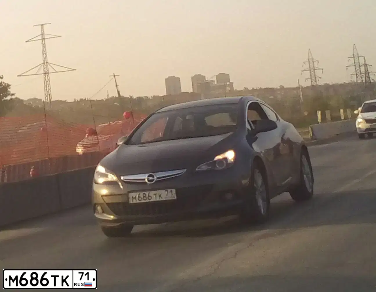 Фото автомобиля OPEL ASTRA, 2012 — госномер М686ТК71. Цвет: ТЕМНО-СЕРЫЙ