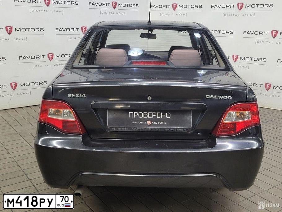 Фото автомобиля DAEWOO NEXIA, 2010 — госномер Е205НК797. Цвет: ЧЕРНЫЙ