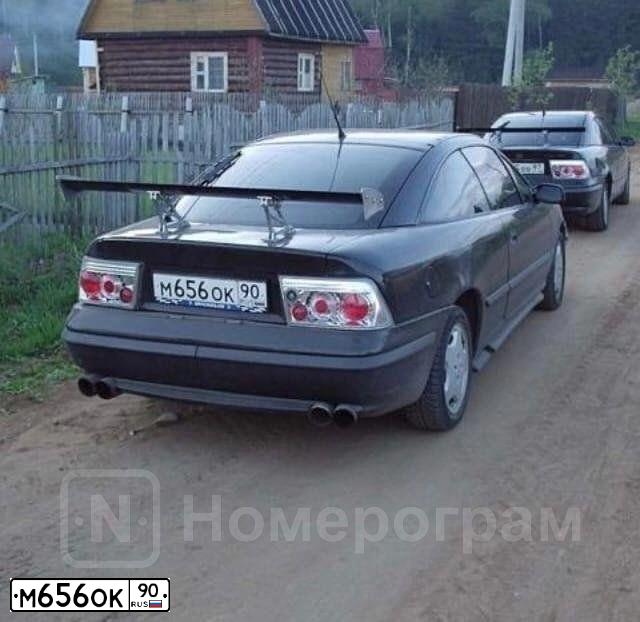 Фото автомобиля OPEL CALIBRA, 1992 — госномер Н044НС68. Цвет: ЧЕРНЫЙ