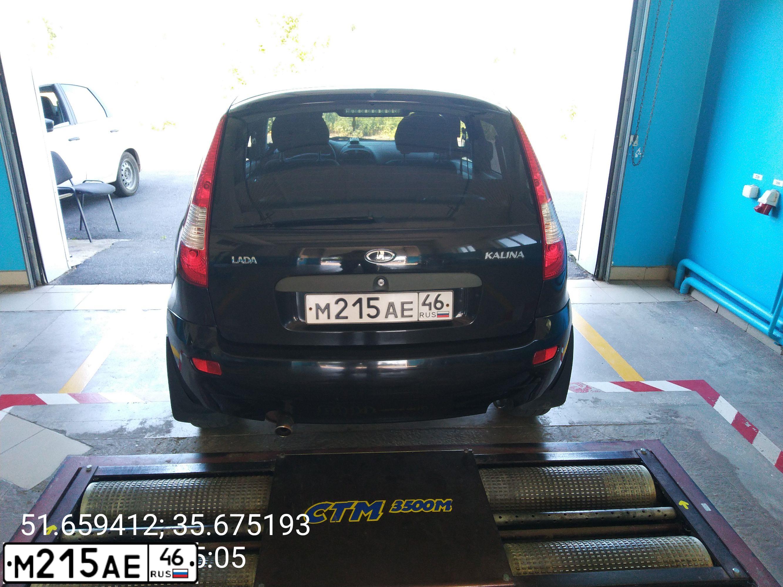 Фото автомобиля LADA 1119 KALINA, 2010 — госномер М215АЕ46. Цвет: ЧЕРНЫЙ
