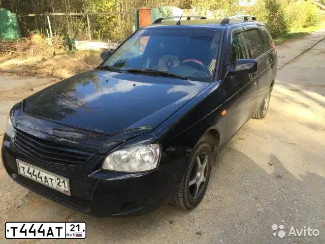 Фото автомобиля LADA 2171 PRIORA, 2011 — госномер М874МХ21. Цвет: СИНЕ-ЧЕРНЫЙ