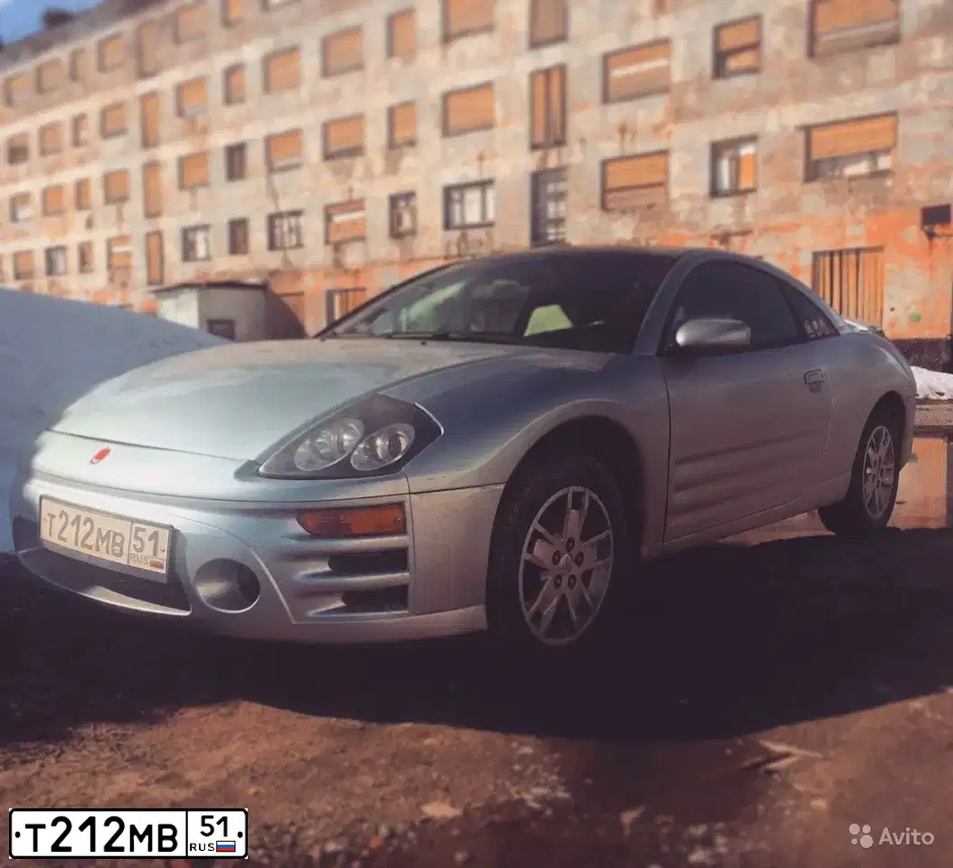 Фото автомобиля MITSUBISHI ECLIPSE, 2003 — госномер Т212МВ51. Цвет: голубой