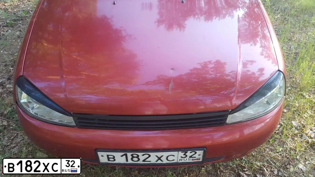Фото автомобиля LADA KALINA, 2006 — госномер Х039НТ31. Цвет: СЕРЕБРИСТО-КРАСНЫЙ