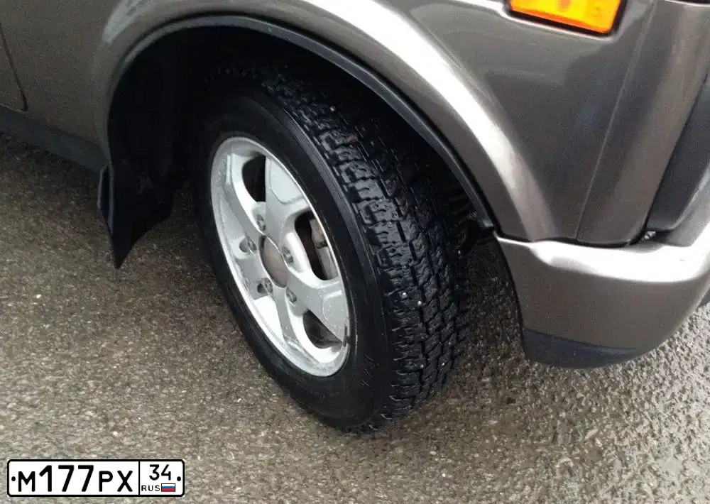 Фото автомобиля MITSUBISHI LANCER, 2008 — госномер К576ВО323. Цвет: Красный