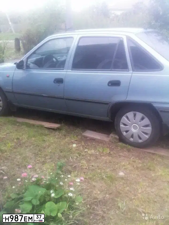 Фото автомобиля DAEWOO NEXIA, 2006 — госномер Н415ОВ750. Цвет: СИНИЙ (СЕРО-ГОЛУБОЙ)