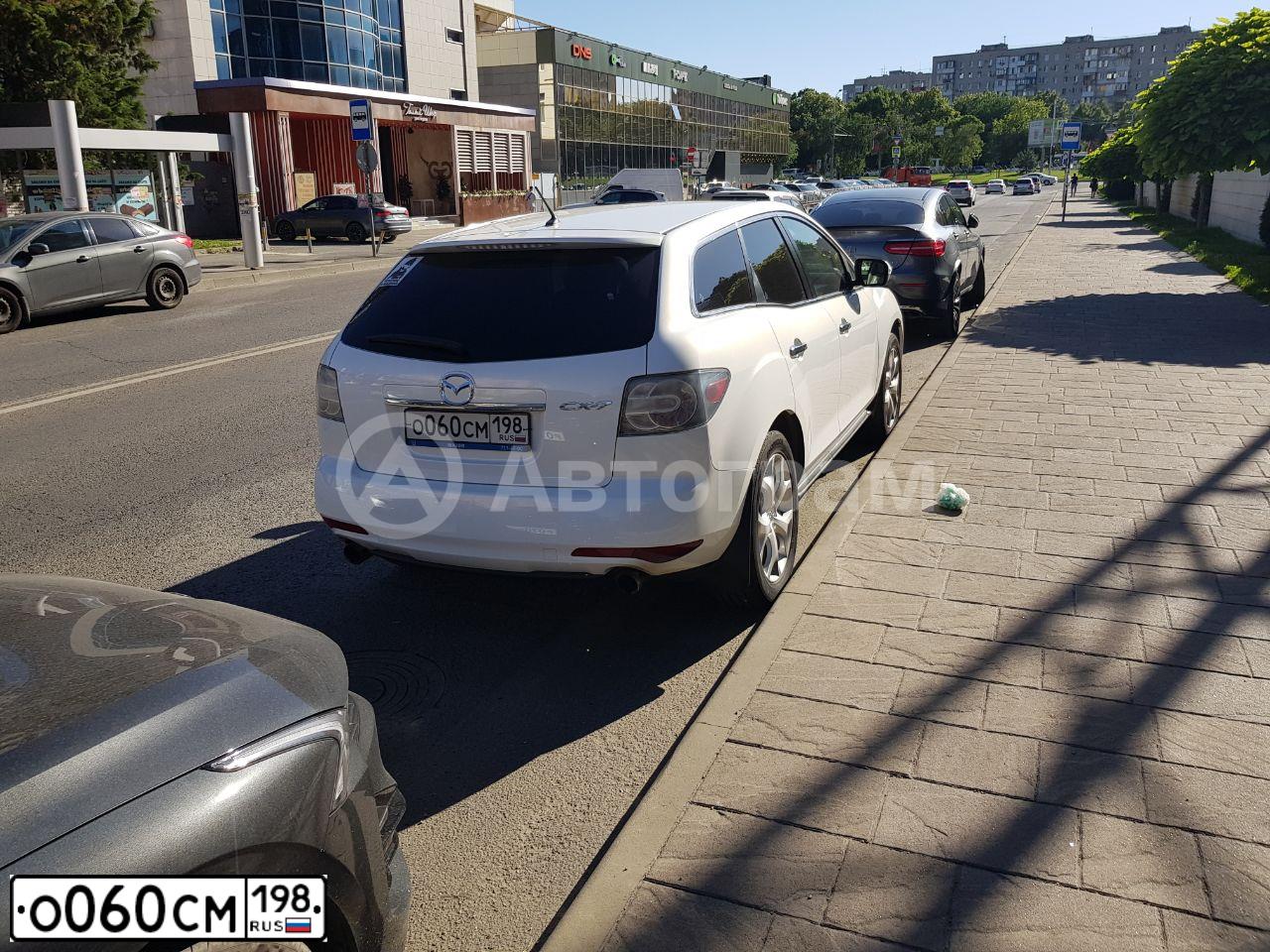 Фото автомобиля MAZDA CX-7, 2011 — госномер В287КМ82. Цвет: Белый