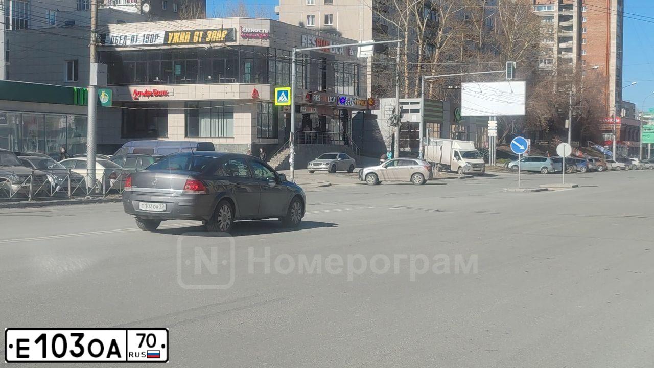 Фото автомобиля OPEL ASTRA, 2011 — госномер Е103ОА70. Цвет: ТЕМНО СЕРЫЙ
