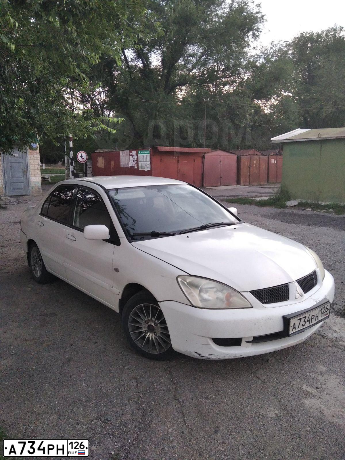Фото автомобиля MITSUBISHI LANCER, 2006 — госномер К855ЕК761. Цвет: Белый
