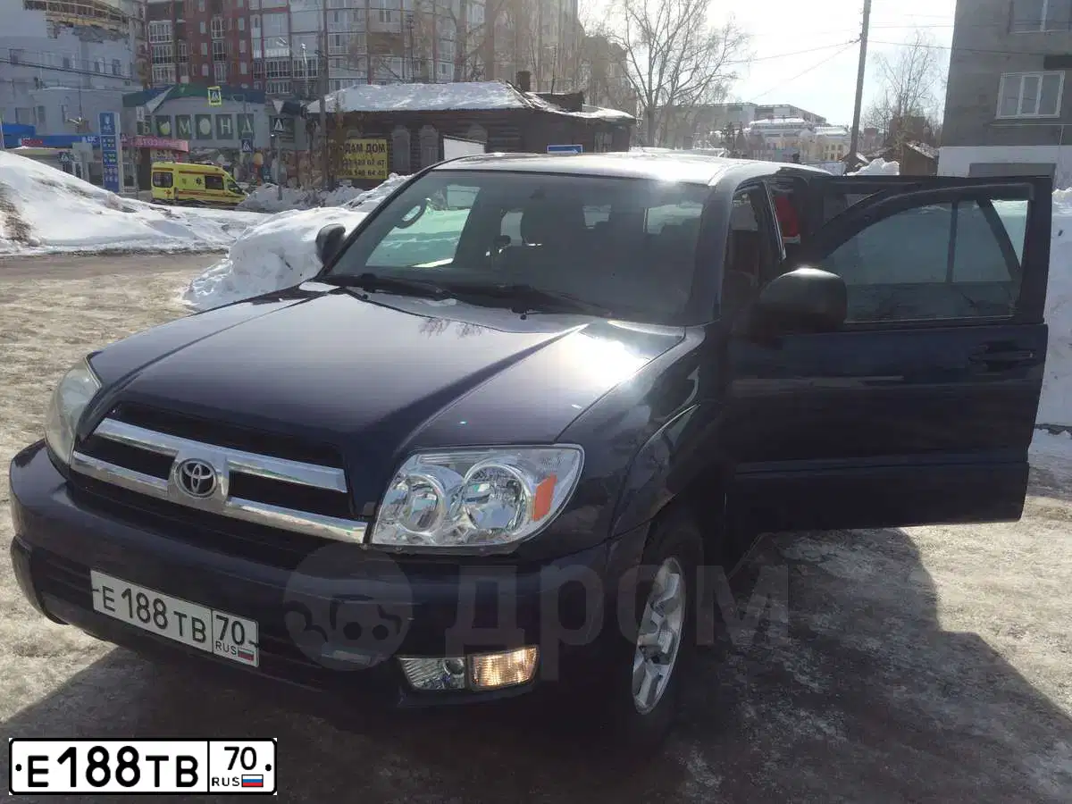Фото автомобиля TOYOTA RUNNER, 2005 — госномер Е961НЕ154. Цвет: ТЕМНО-СИНИЙ