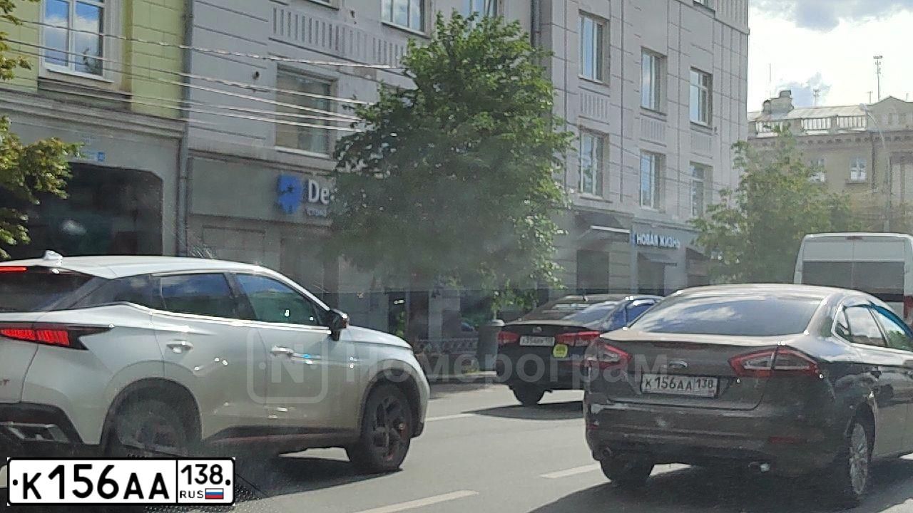 Фото автомобиля FORD MONDEO, 2011 — госномер К156АА138. Цвет: СЕРО-КОРИЧНЕВЫЙ