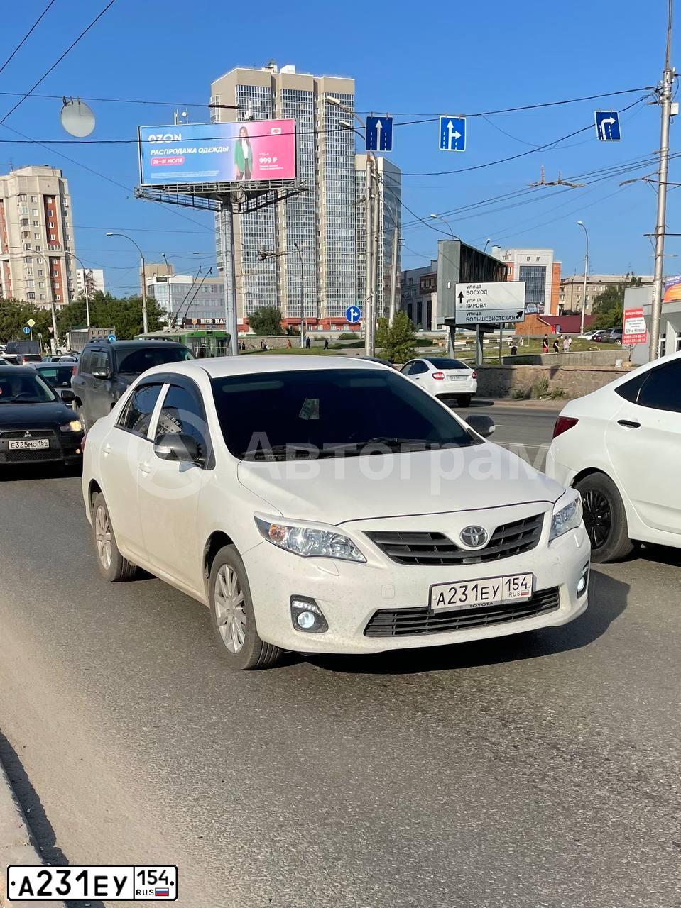 Фото автомобиля TOYOTA COROLLA, 2010 — госномер А231ЕУ154. Цвет: Белый