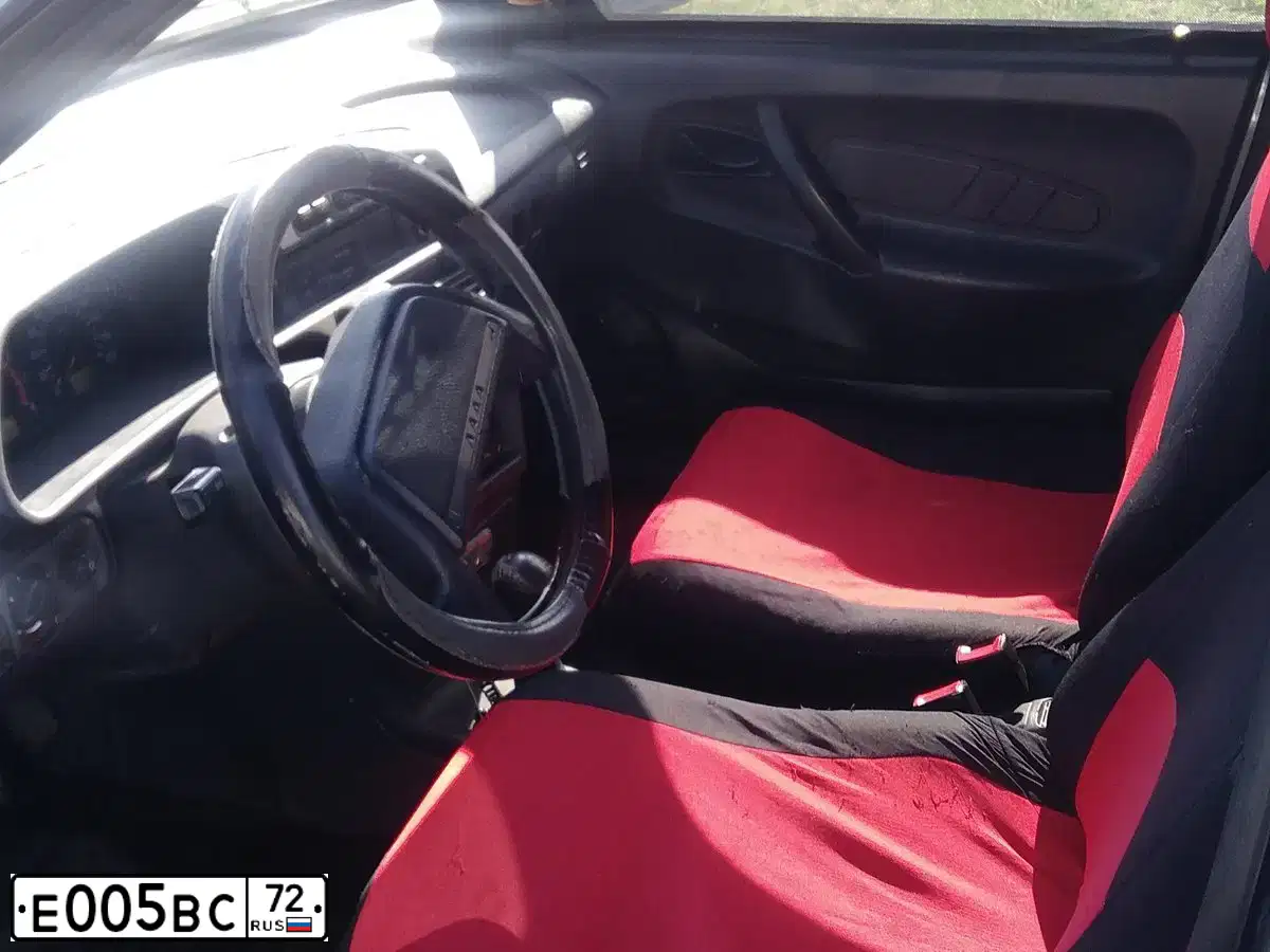 Фото автомобиля RENAULT SANDERO, 2012 — госномер Е005ВС72. Цвет: Белый