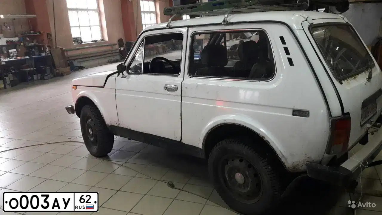 Фото автомобиля LADA 2121 NIVA, 1997 — госномер О003АУ62. Цвет: Белый