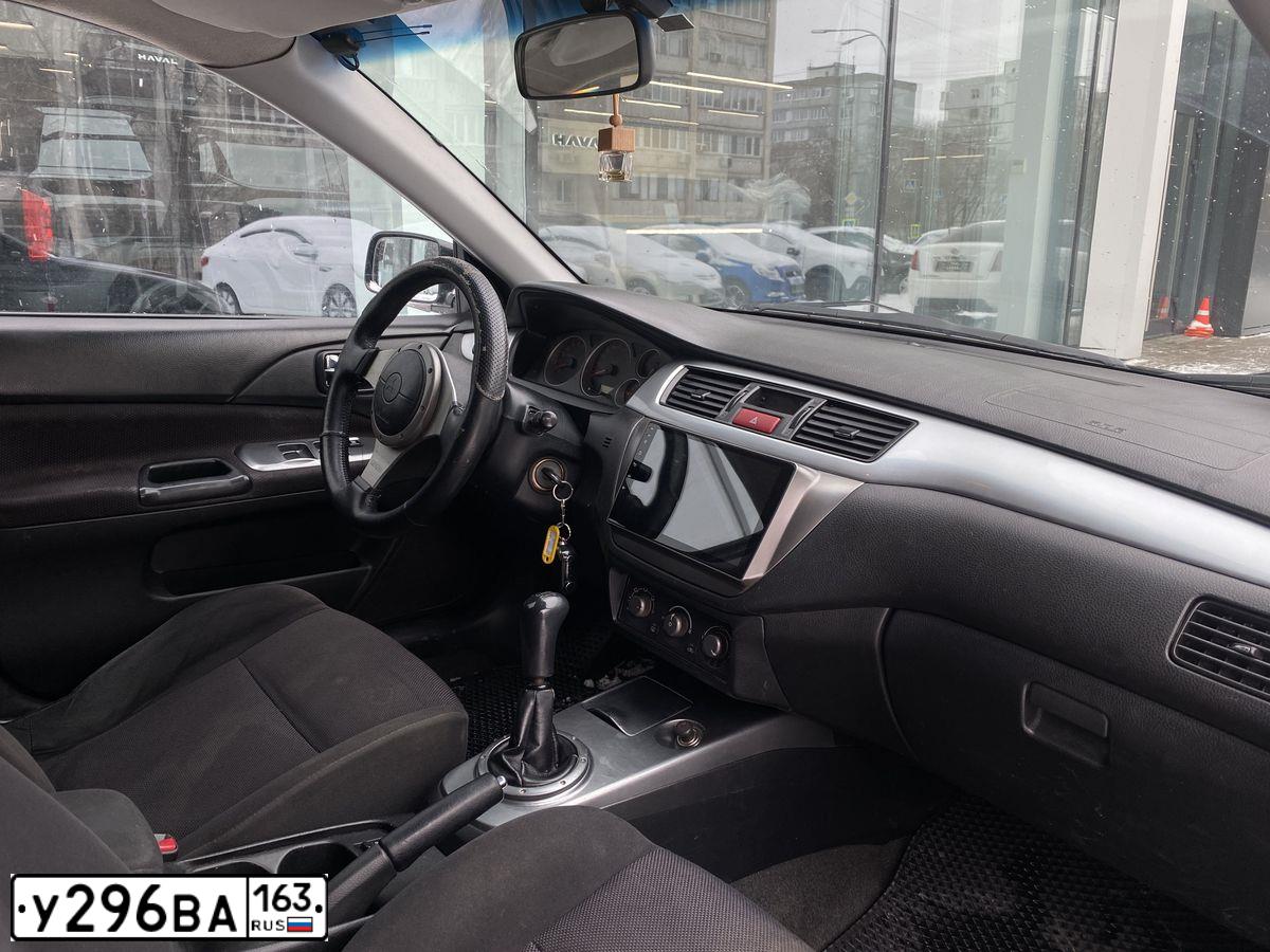 Фото автомобиля MITSUBISHI LANCER, 2006 — госномер Е740ТР156. Цвет: ЧЕРНЫЙ