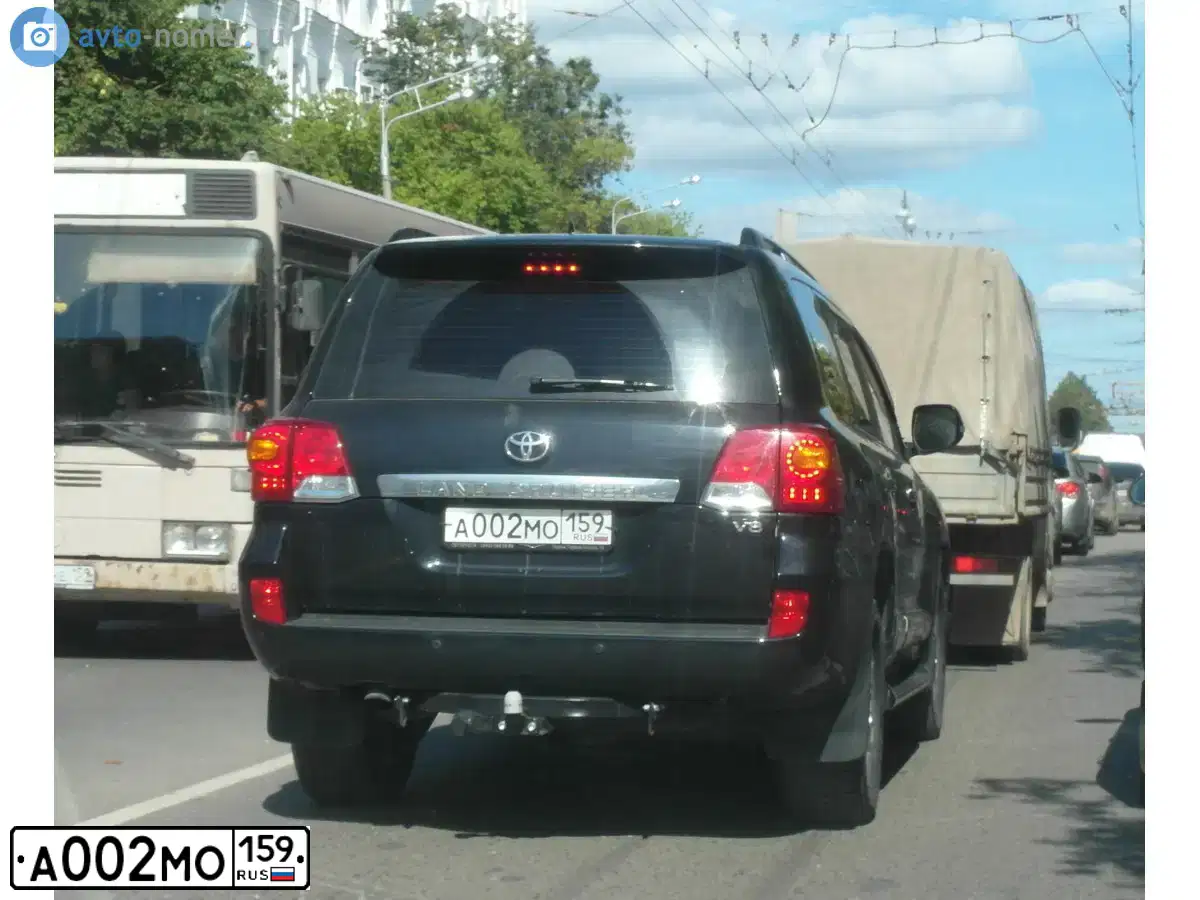 Фото автомобиля KAMAZ 65116 /6X4/, 2011 — госномер А002МО159. Цвет: ЖЕЛТЫЙ ГЕОРГИН