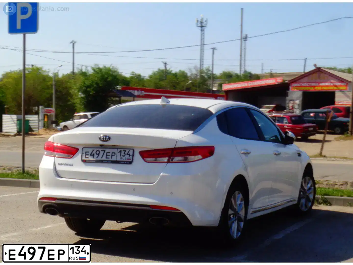 Фото автомобиля KIA MAGENTIS  OPTIMA, 2018 — госномер Е497ЕР134. Цвет: БЕЛЫЙ