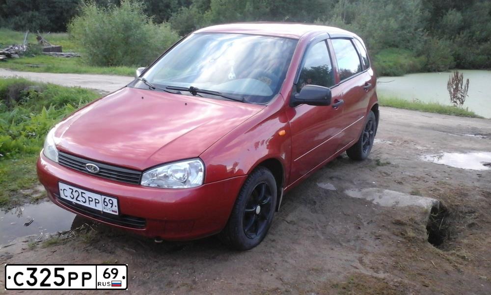 Фото автомобиля LADA 1119 KALINA, 2009 — госномер С325РР69. Цвет: СЕРЕБРИСТО-КРАСНЫЙ