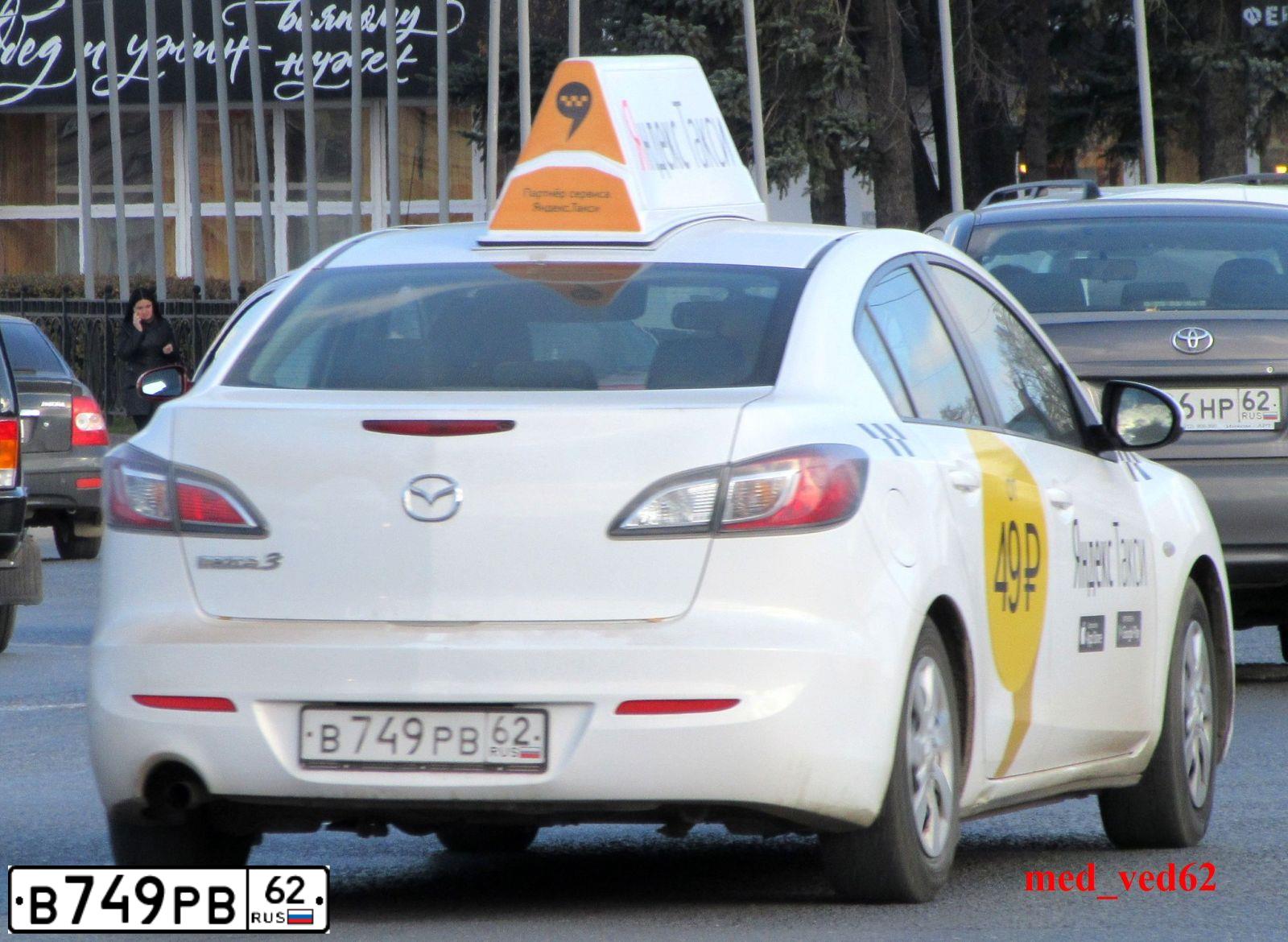 Фото автомобиля MAZDA 3, 2011 — госномер В749РВ62. Цвет: БЕЛЫЙ