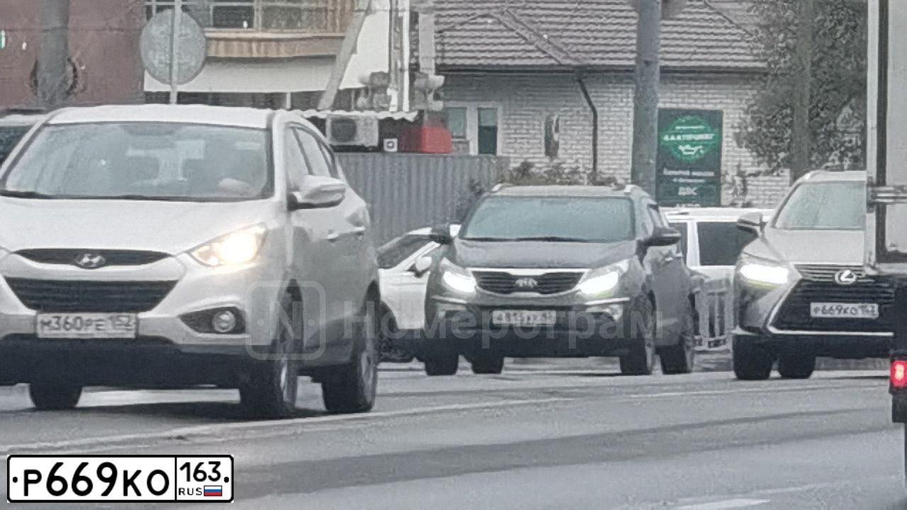 Фото автомобиля KIA SPORTAGE, 2011 — госномер Е733НК134. Цвет: ЧЕРНЫЙ ПЕРЛАМУТР