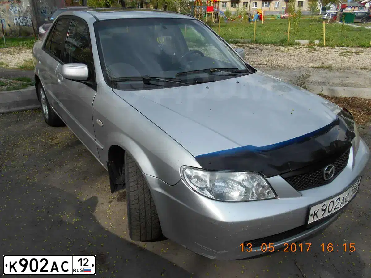 Фото автомобиля NISSAN ALMERA, 1997 — госномер К068УУ186. Цвет: Красный