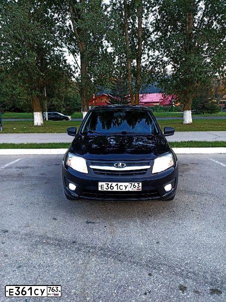 Фото автомобиля LADA 2190 GRANTA, 2015 — госномер Н307РЕ73. Цвет: ЧЕРНЫЙ
