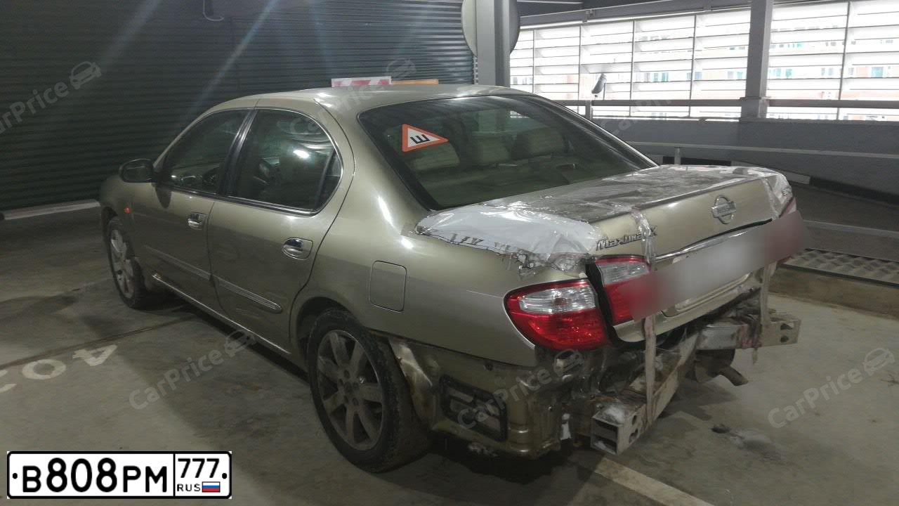 Фото автомобиля NISSAN MAXIMA, 2003 — госномер Е955УЕ790. Цвет: ЗОЛОТИСТЫЙ