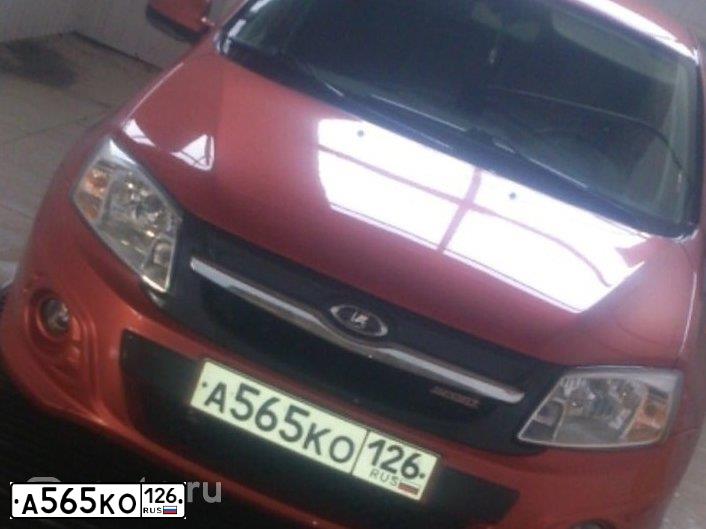 Фото автомобиля LADA GRANTA, 2015 — госномер В770СТ09. Цвет: Оранжевый