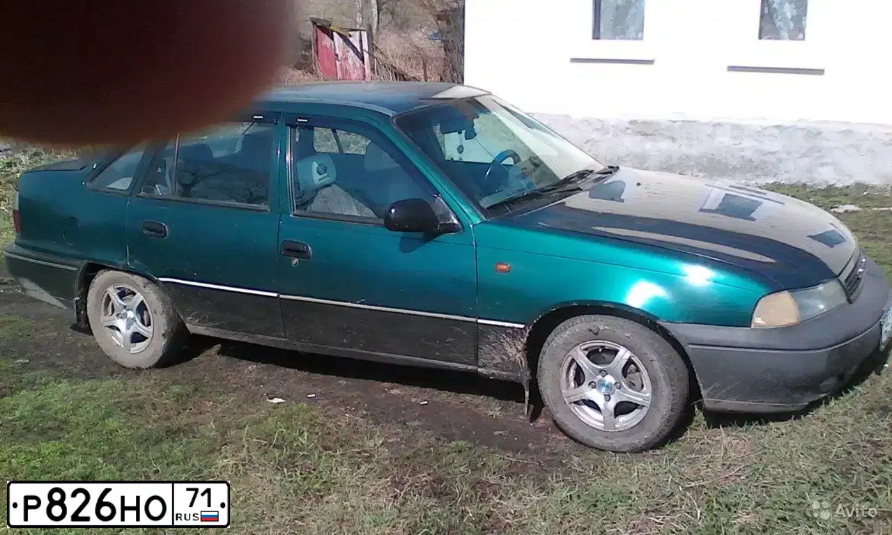 Фото автомобиля DAEWOO O NEXIA, 1999 — госномер Р826НО71. Цвет: ЗЕЛЕНО-ПЕРЛАМУТРОВЫЙ