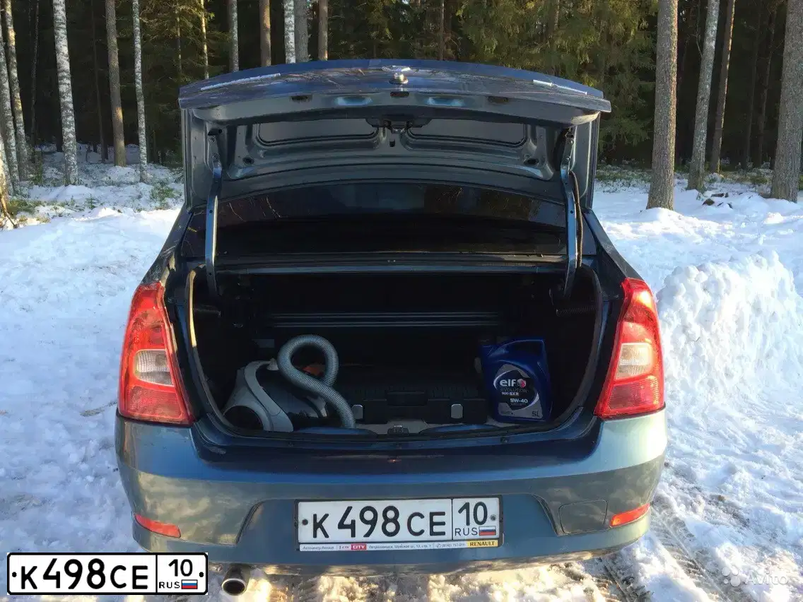 Фото автомобиля RENAULT LOGAN, 2010 — госномер Н021ВК10. Цвет: синий