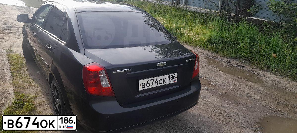 Фото автомобиля CHEVROLET LACETTI, 2011 — госномер В674ОК186. Цвет: ЧЕРНЫЙ