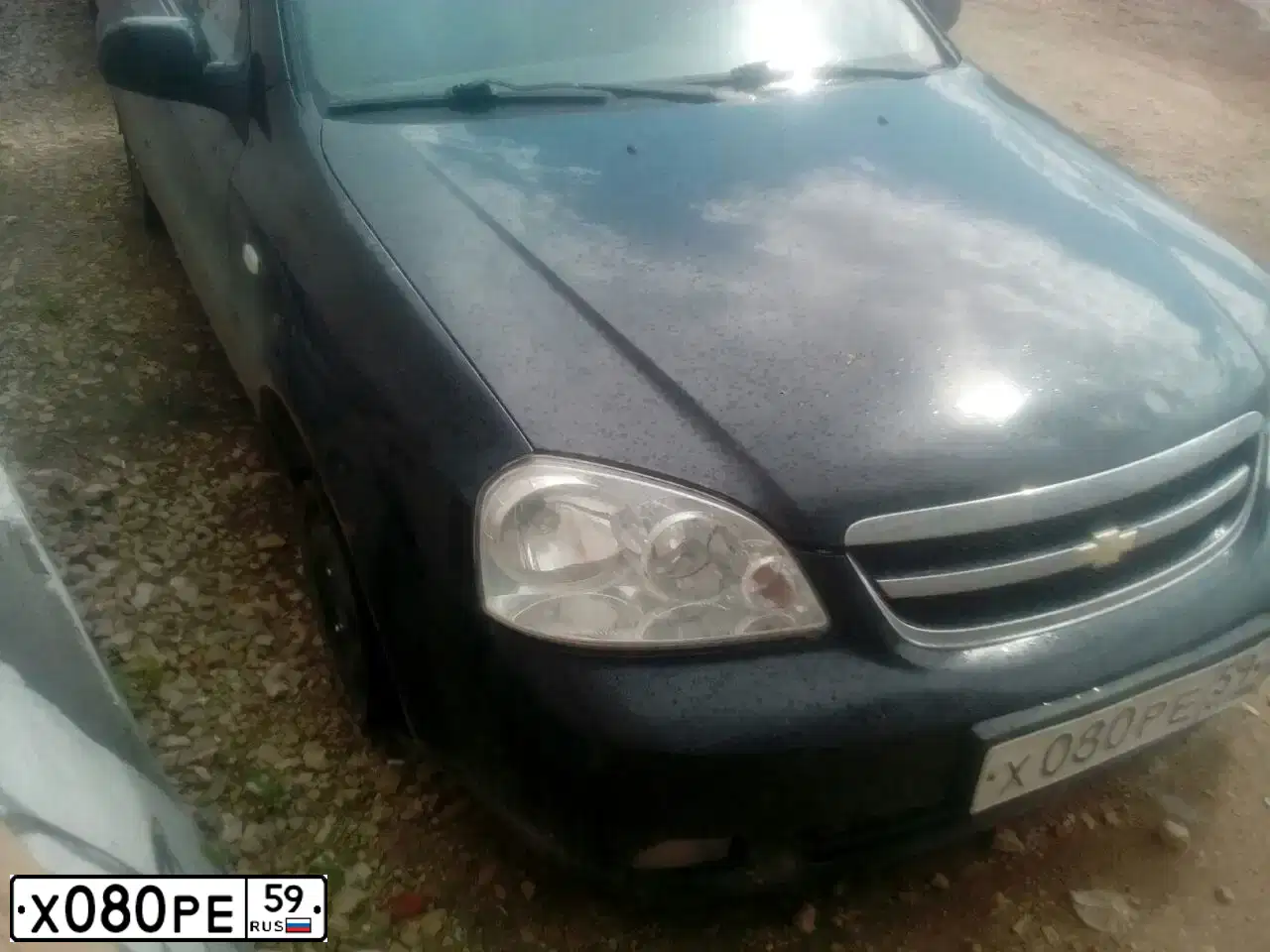 Фото автомобиля CHEVROLET LACETTI, 2008 — госномер Х080РЕ59. Цвет: ЧЕРНЫЙ
