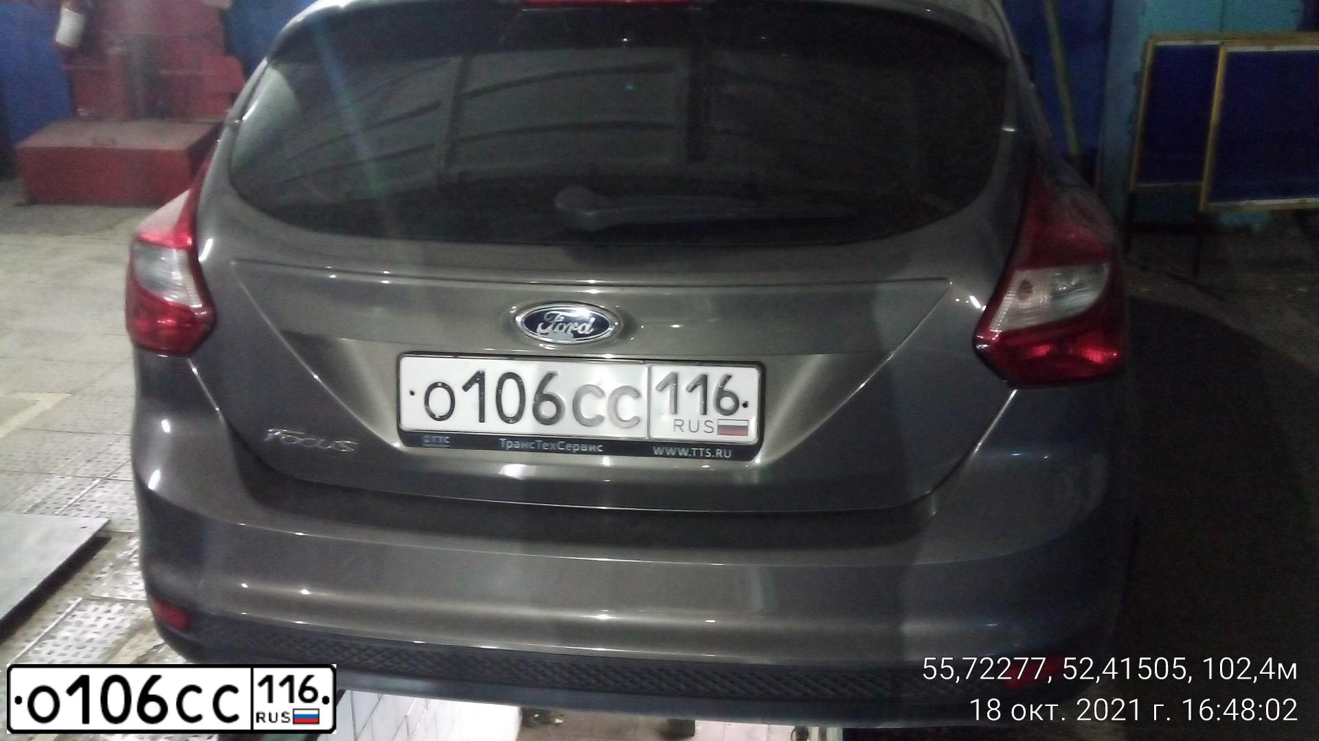 Фото автомобиля FORD FOCUS, 2011 — госномер О106СС116. Цвет: СЕРО-КОРИЧНЕВЫЙ