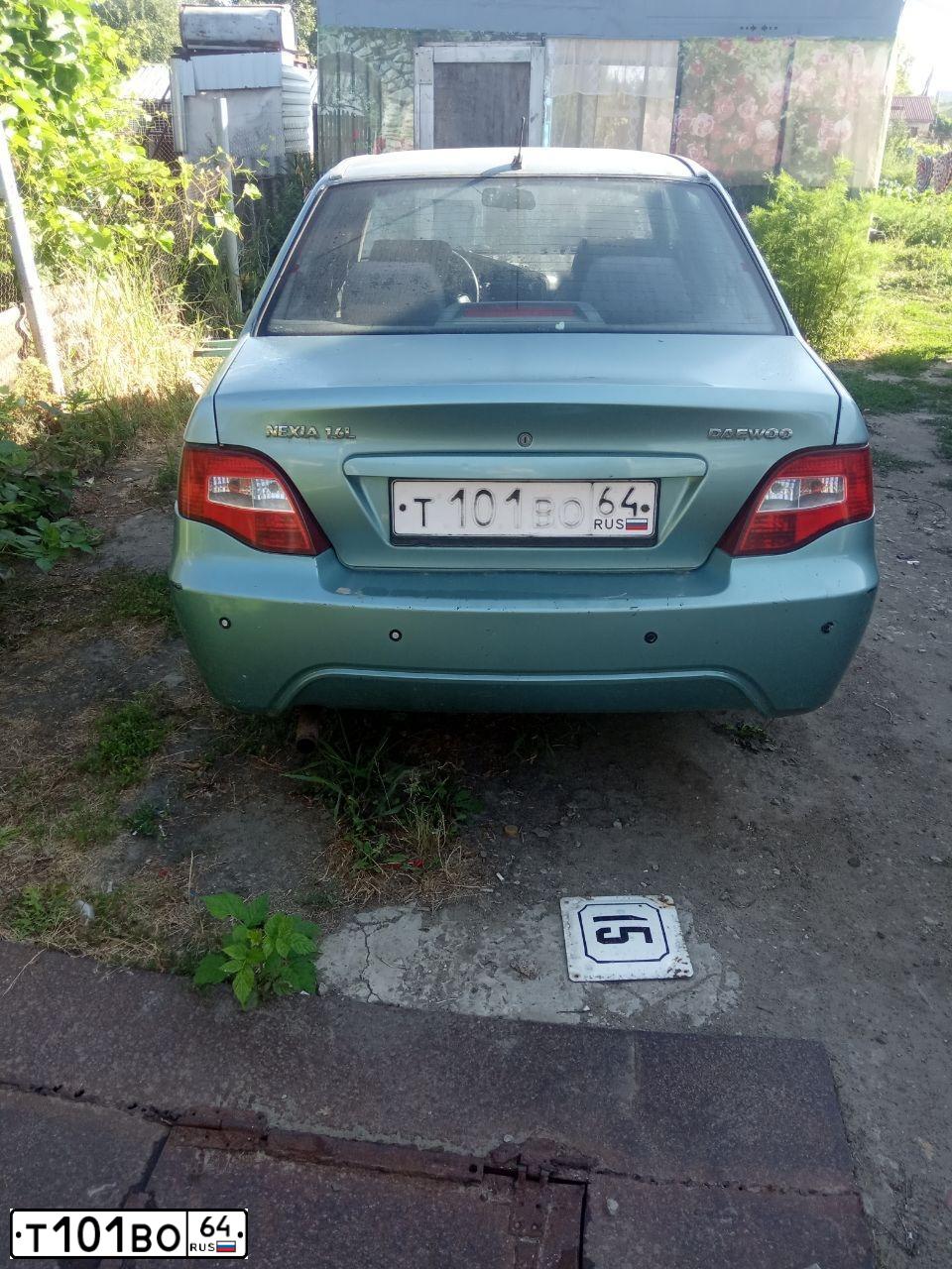 Фото автомобиля DAEWOO NEXIA, 2009 — госномер Т101ВО64. Цвет: ЗЕЛЕНАЯ ГЛАЗУРЬ